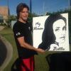 SINGER STOKES NIELSON WITH PAINTING OF HIS NEW ALBUM COVER